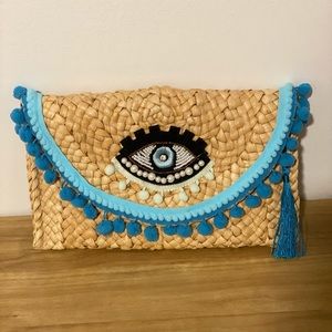 Evil eye straw clutch